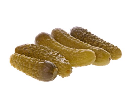 Isolated macro image of pickled gherkins.
