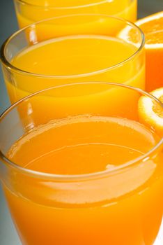 fresh and healthy orange juice ,unfiltered ,over a light table