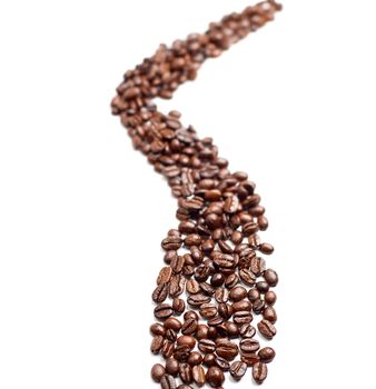 bounch of roasted coffee beans mimic a road shape