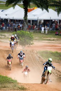 Image of motocross participants in action.