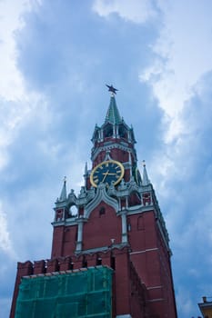 Moscow, Russia, Towers and Fragment Kremlin Wall on light-blue Spring Sky, Chimes Spasskaya Towers 