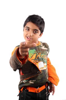 A brat Indian kid giving a warning, on white studio background.