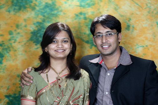 A portrait of a cute young Indian couple in their wedding reception.