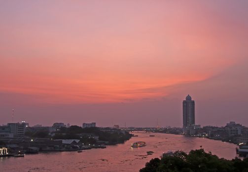 Sunset over the Mae Nam Chao Phraya River in Bangkok, Thailand.