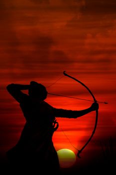 A silhouette of an archer aiming at the enemy at sunrise during an ancient war.
