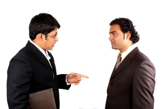 Two young Indian businessman in a business discussion, on white studio background.