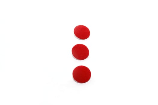 Three red round buttons on white background