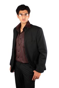 A portrait of a handsome young Indian business manager, on white studio background.