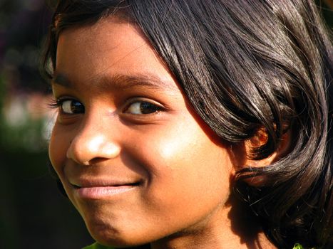 A portrait of a cute poor girl from India