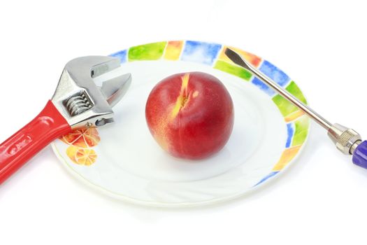 Futuristic scene of juicy nectarine for the cyborg`s diet nutrition. It`s hard enough to eat with screw-driver and wrench.