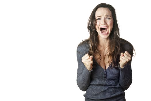 A strong image of a very upset and emotional woman crying and screaming. Isolated on white.