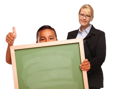 Hispanic Boy Holding Chalk Board with Thumbs Up and Female Teacher Behind Isolated on a White Background.