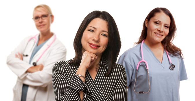 Hispanic Woman with Female Doctor and Nurse Isolated on a White Background.