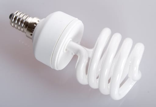 close-up fluorescent light bulb on gray background