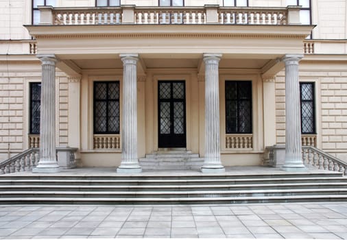Entrance of historical building with steps and columns