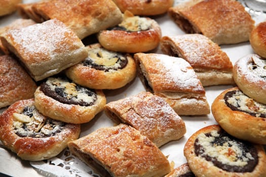 Home made cakes strewn with powdered sugar