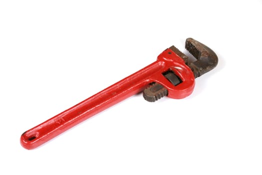 Red pipe wrench isolated on white