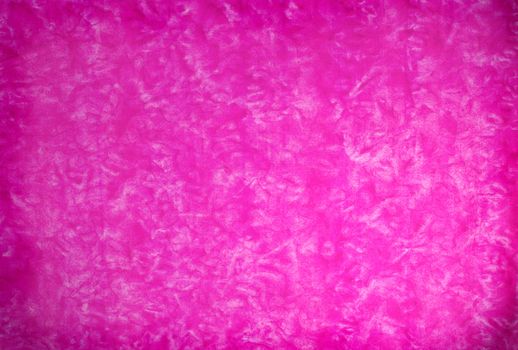 Pink mottled grunge background in variating hues