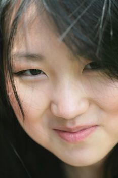 smiling beautiful orient model, close-up portrait