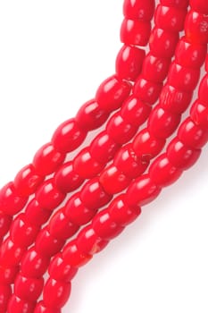 coral necklace, bright red beads, fragment