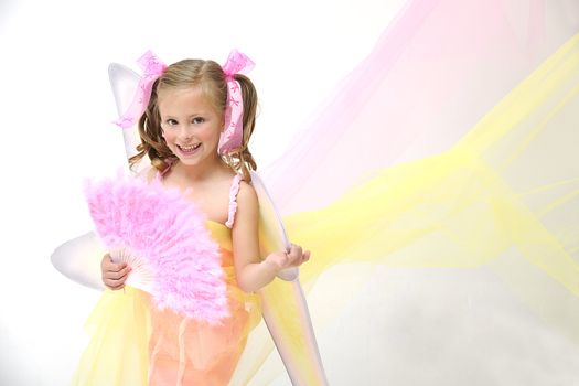 young pretty blond girl standing with angle wings and a pink chinese fan