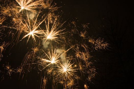 Exploding Golden Stars at New Years evening