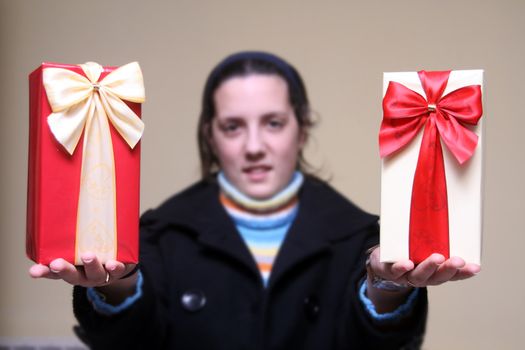 young girl giving gifts (focus on the present)