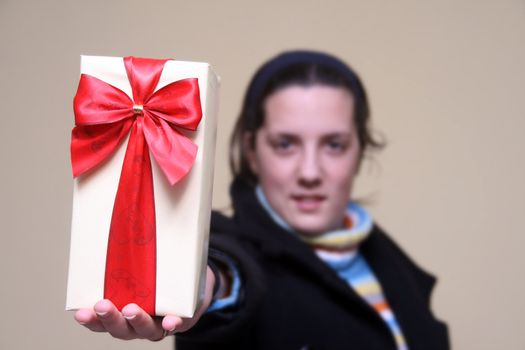 young girl giving gifts (focus on the present)