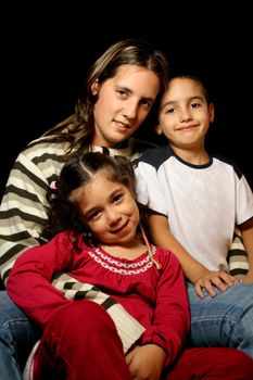 aunt and nephews over black background