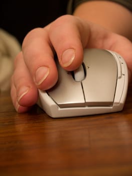 Human hand using silver computer   mouse