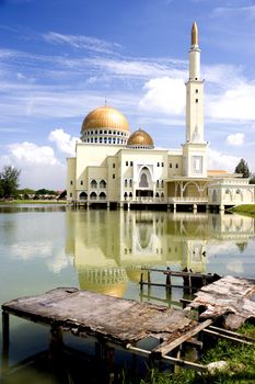Floating mosque with gold coloured domes in Malaysia.