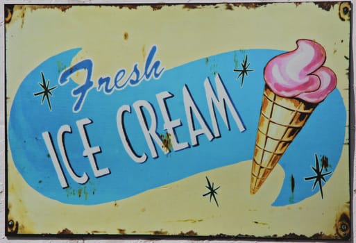 Classic, vintage metal, advertising sign for fresh icecream.