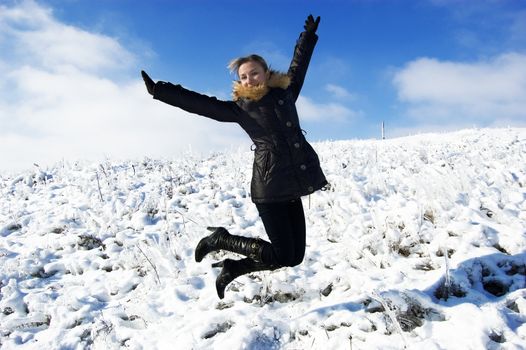 girl jumping in the snow