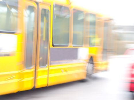 Motion Blur of a Yellow bus  driving