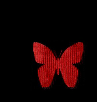 bright red butterfly shape in knitting pattern on black