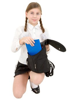 Schoolgirl and book on the white background