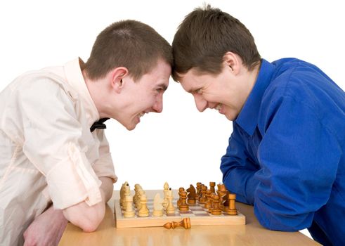 Boys play chess on a white background