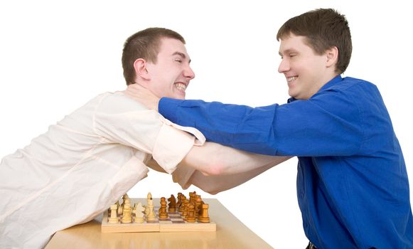 Boys play chess and fight with each other 