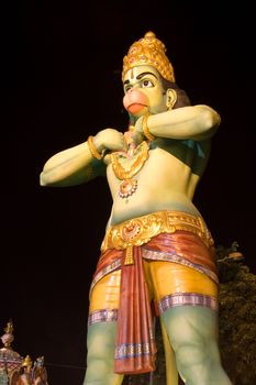 Image of the giant Hindu Monkey God at night at Batu Caves Temple, Kuala Lumpur, Malaysia.