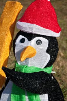 Funny Christmas penguin character wearing hat and scarf