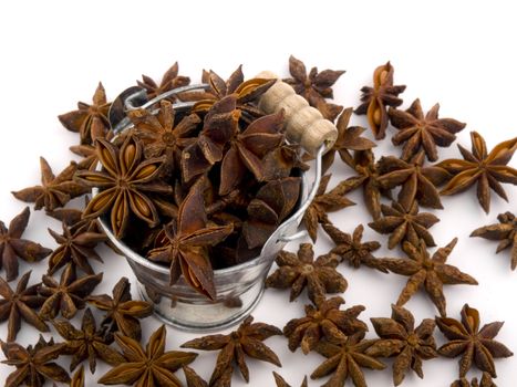 Aromatic anise in small bucket on white background