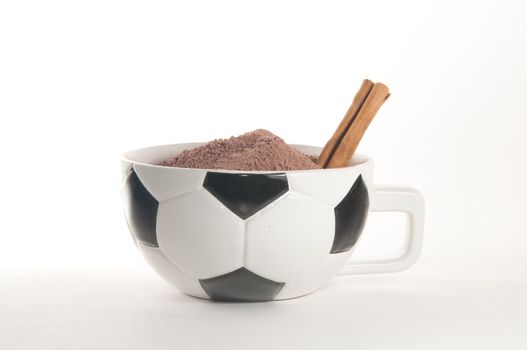 Football(soccer) themed cappucino cup over white background