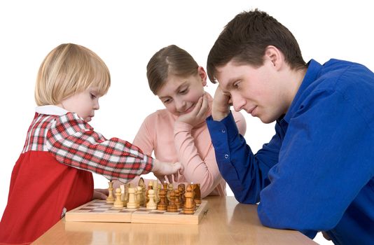 Man and child play chess on white 