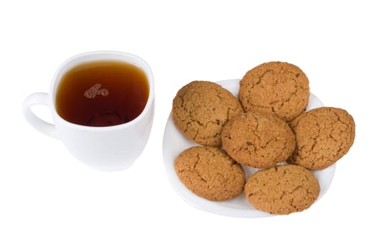 tea and five cookies on plate, isolated on white