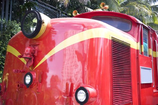 Image of a bright red vintage diesel train.