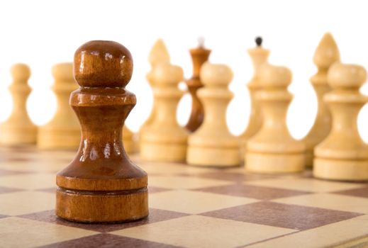 Brown wooden chess pawn on a white background