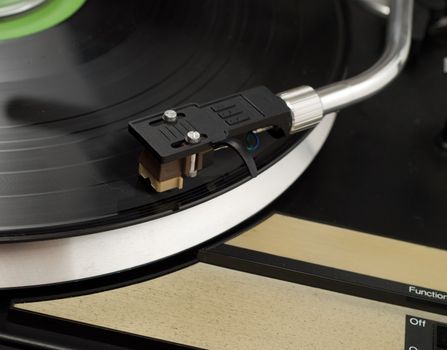 Closeup of a record player, playing music