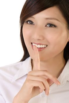 Happy businesswoman with silent gesture, closeup up portrait of oriental office lady.