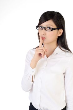 Cute business woman with silent gesture on lips, closeup portrait of oriental office lady on white background.