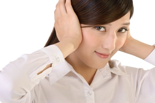 Beautiful businesswoman put hands on ears, closeup portrait of oriental office lady on white background.